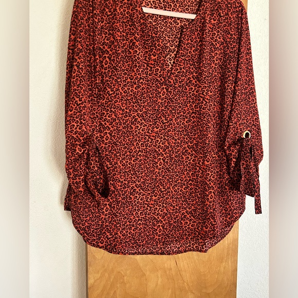 Michael Kors orange and black leopard print shirt. - Picture 3 of 4